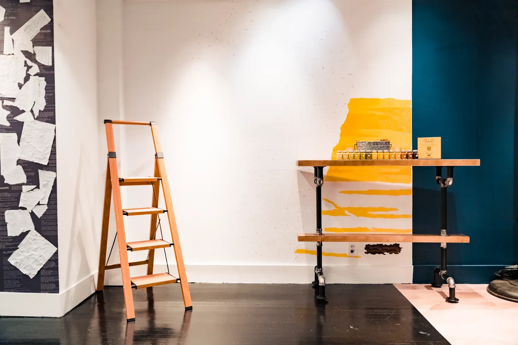 Blank Ed Sheeran Subtract paint-by-number mural with numbered paints, worktable, and ladder