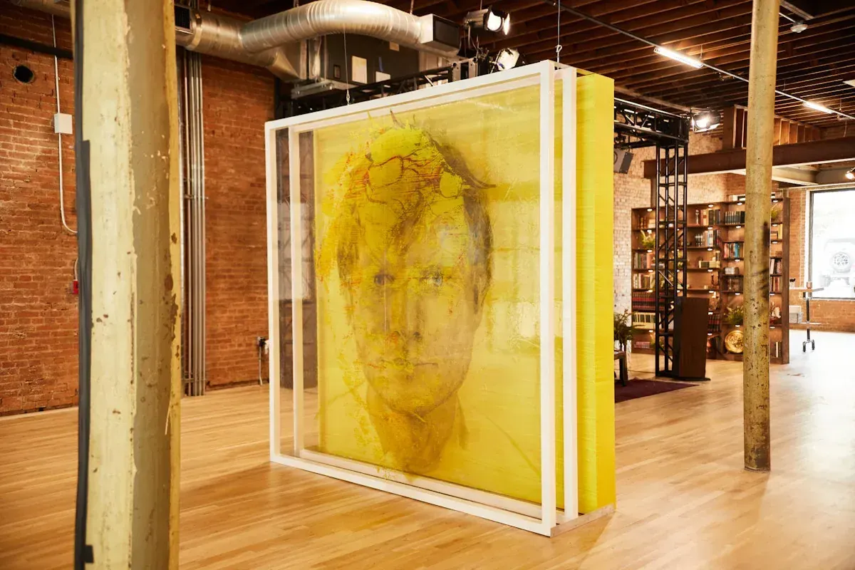Layered yellow Ed Sheeran Subtract album artwork installation inside the pop-up