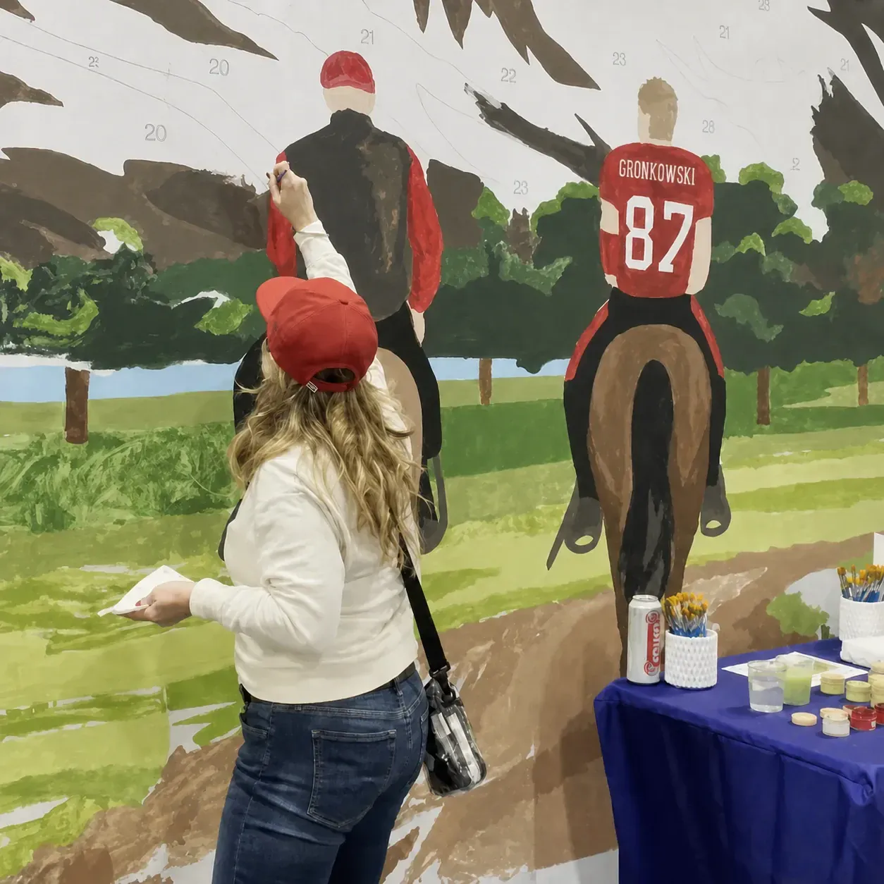 Fans painting the 30-foot Super Bowl mural
